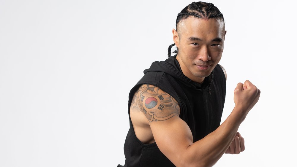 Chris in a fight stance, upper-body studio portrait
