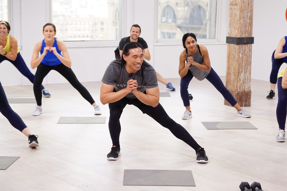 Chris leading a packed studio class mid-session