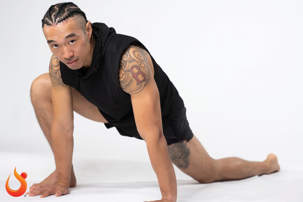 Chris in a deep low lunge, studio portrait