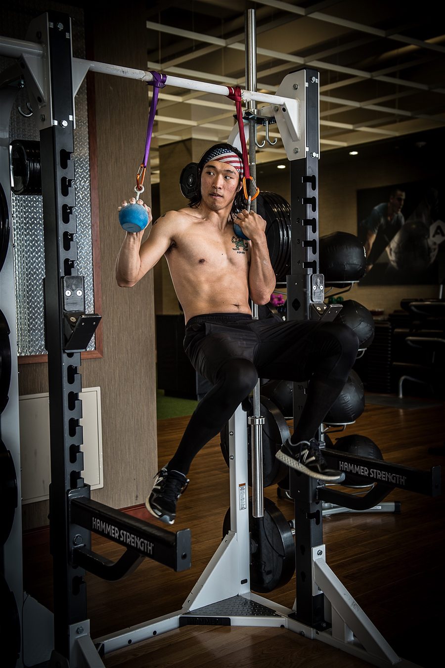 Chris training on hanging cannonball grips, American Ninja Warrior style