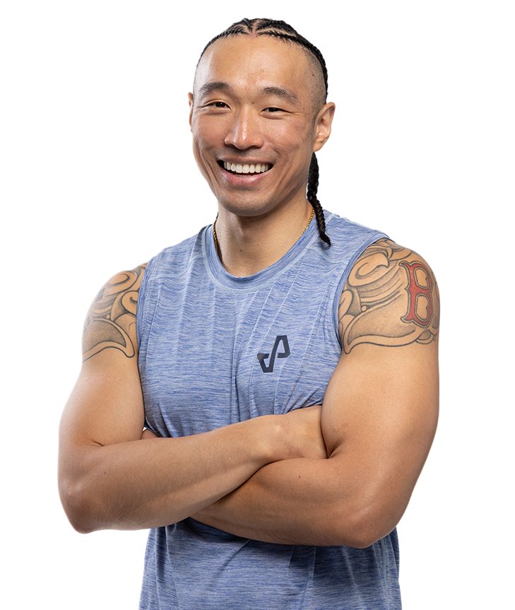 Chris Poirier-Kim, smiling with arms crossed, trainer hero portrait